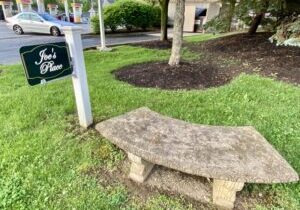 Joe's Place Sign and Park Bench